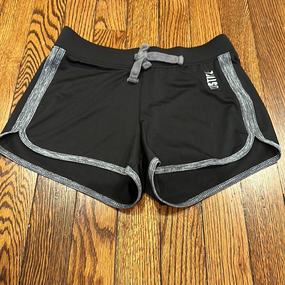 Justice size ten girls sports shorts black, with Bret details.